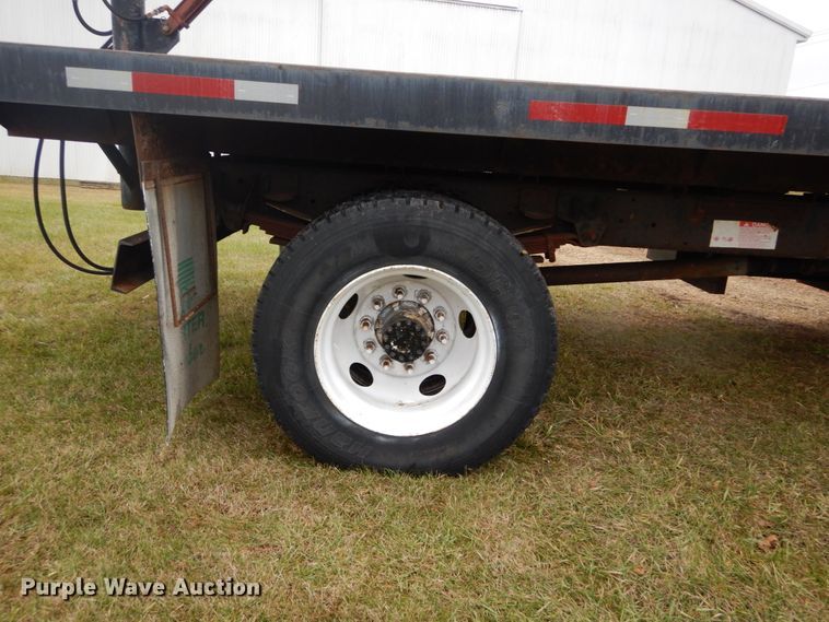 image for item DH5044 2003 GMC C7500 flat dump bed truck with conveyor