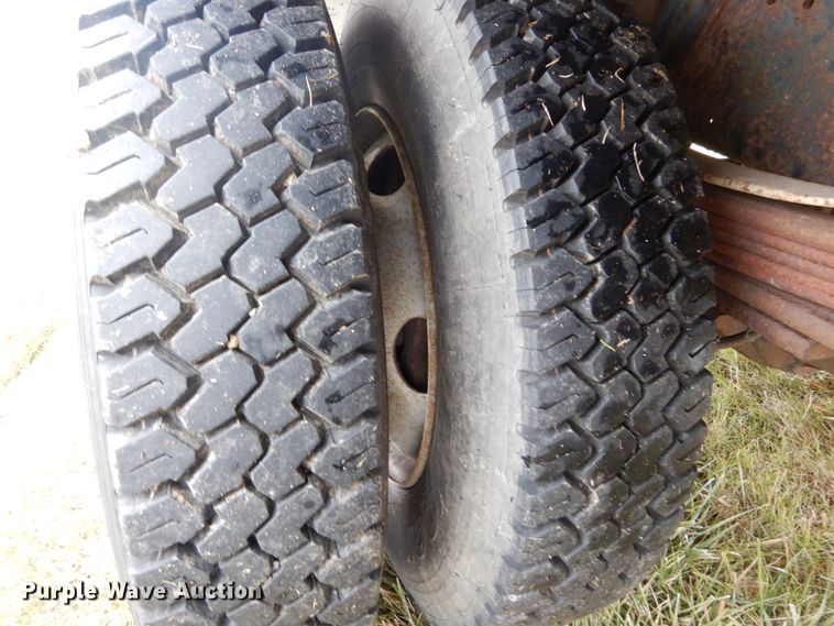 image for item DH5044 2003 GMC C7500 flat dump bed truck with conveyor