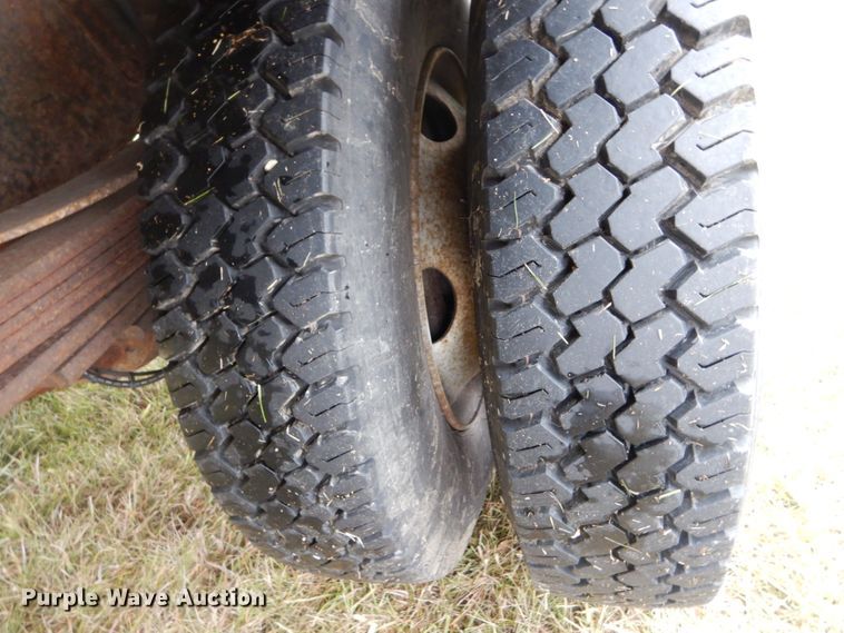 image for item DH5044 2003 GMC C7500 flat dump bed truck with conveyor