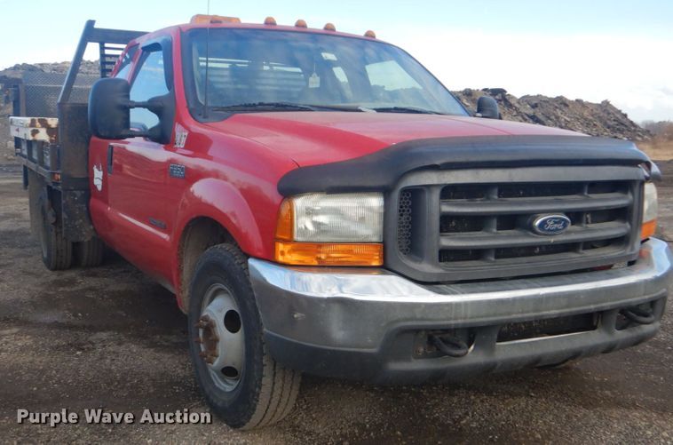 image for item DI2391 2000 Ford F350 Super Duty SuperCab flatbed pickup truck