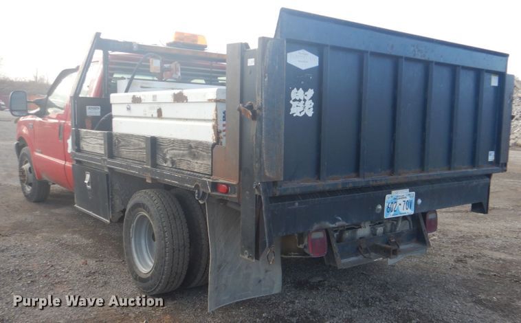 image for item DI2391 2000 Ford F350 Super Duty SuperCab flatbed pickup truck