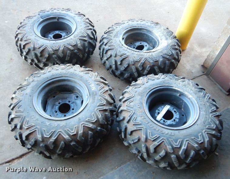 image for item GF9991 (4) 27x9.00R12 foam-filled tires and wheels