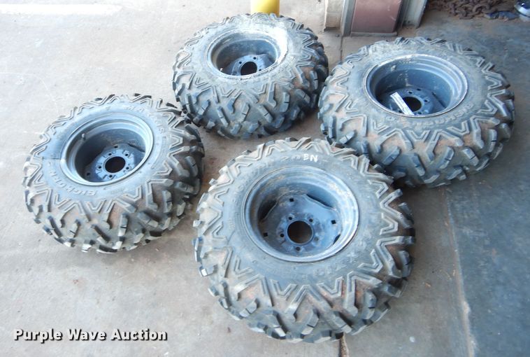 image for item GF9991 (4) 27x9.00R12 foam-filled tires and wheels