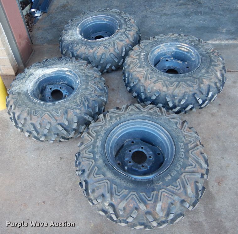 image for item GF9991 (4) 27x9.00R12 foam-filled tires and wheels