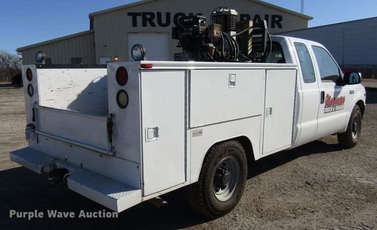 image for item DH8332 1999 Ford F250 Super Duty SuperCab utility bed pickup truck