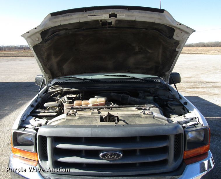 image for item DH8332 1999 Ford F250 Super Duty SuperCab utility bed pickup truck