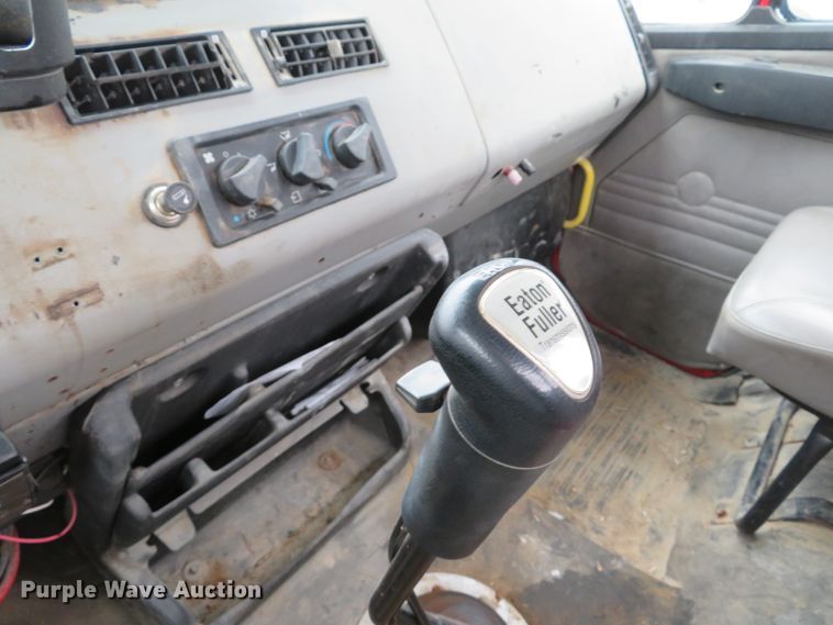 image for item DI2025 2003 Freightliner FL70 flatbed truck