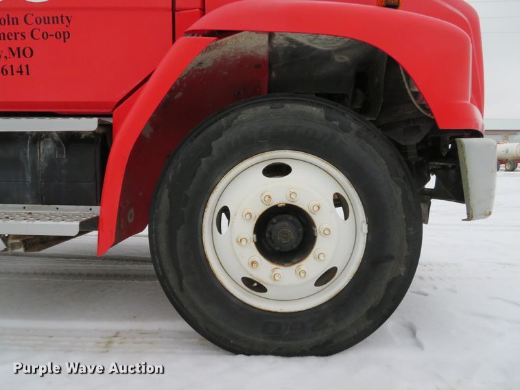 image for item DI2025 2003 Freightliner FL70 flatbed truck