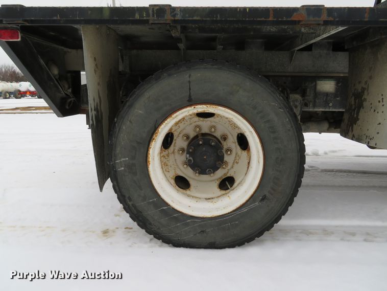 image for item DI2025 2003 Freightliner FL70 flatbed truck