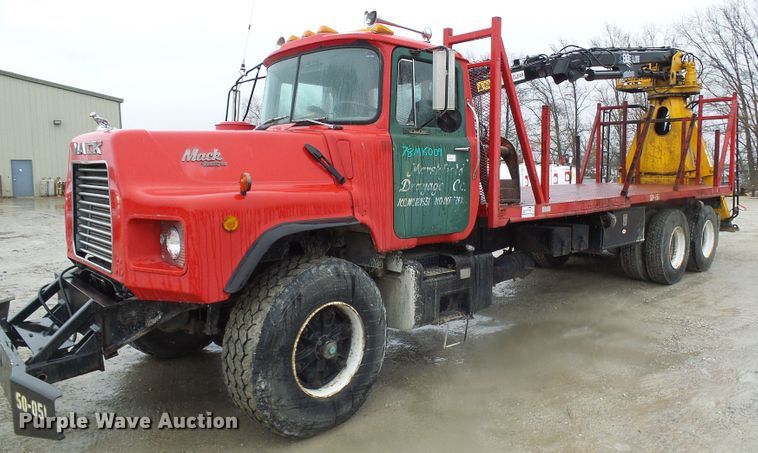 image for item DD1957 1989 Mack DM690S knuckle boom crane truck with grapple