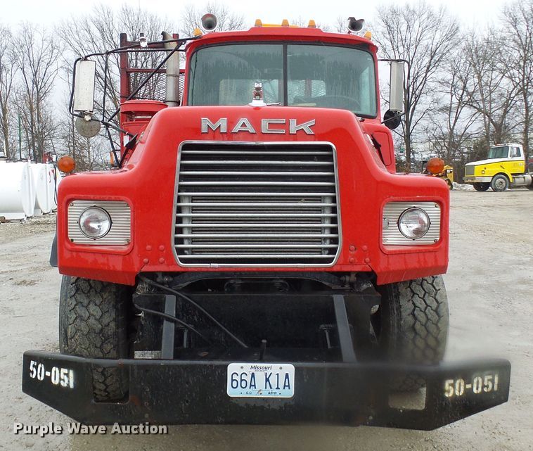 image for item DD1957 1989 Mack DM690S knuckle boom crane truck with grapple