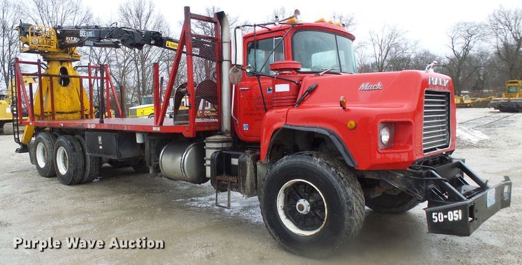 image for item DD1957 1989 Mack DM690S knuckle boom crane truck with grapple