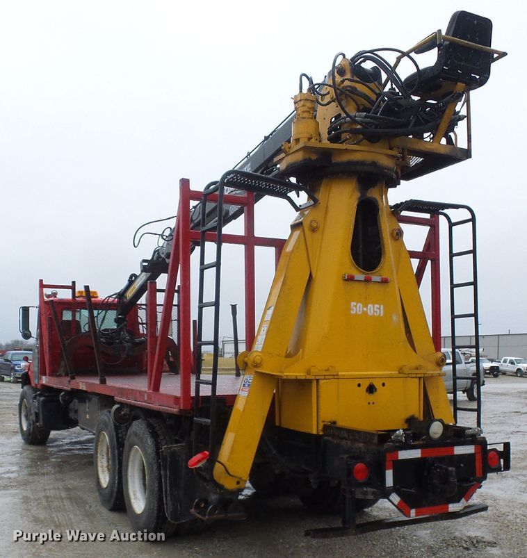 image for item DD1957 1989 Mack DM690S knuckle boom crane truck with grapple