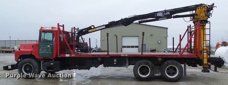 image for item DD1957 1989 Mack DM690S knuckle boom crane truck with grapple