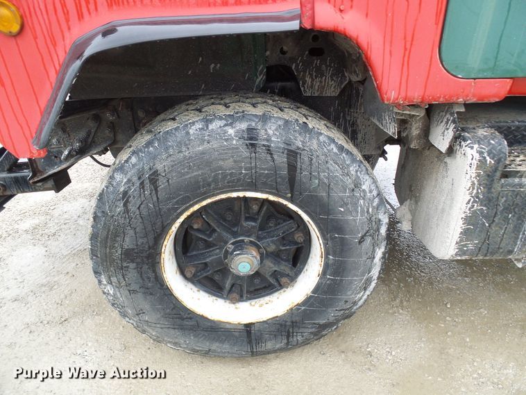 image for item DD1957 1989 Mack DM690S knuckle boom crane truck with grapple