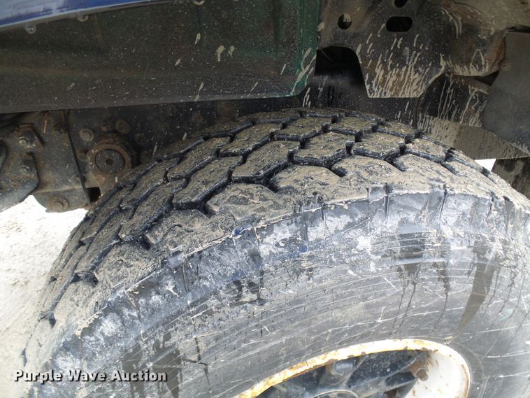 image for item DD1957 1989 Mack DM690S knuckle boom crane truck with grapple