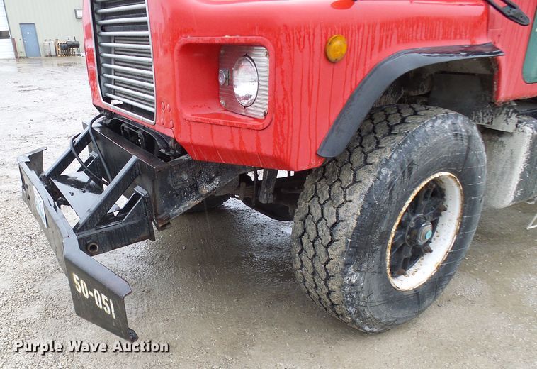 image for item DD1957 1989 Mack DM690S knuckle boom crane truck with grapple