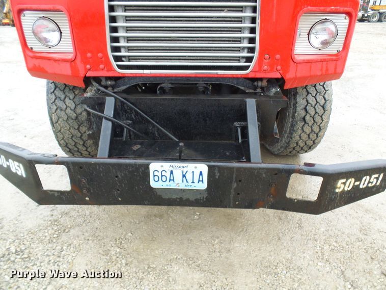 image for item DD1957 1989 Mack DM690S knuckle boom crane truck with grapple