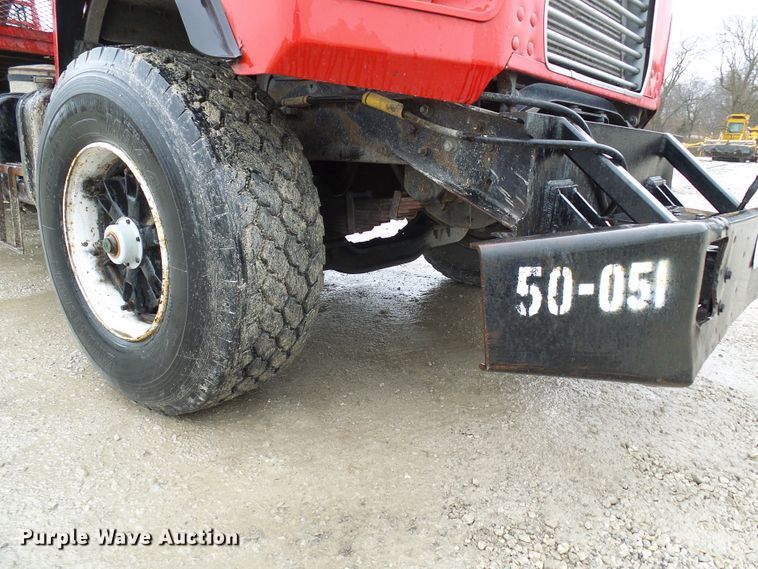 image for item DD1957 1989 Mack DM690S knuckle boom crane truck with grapple