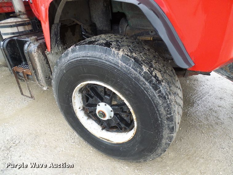 image for item DD1957 1989 Mack DM690S knuckle boom crane truck with grapple