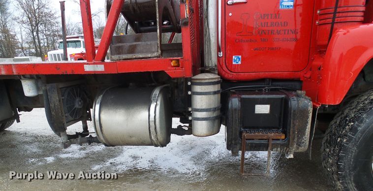 image for item DD1957 1989 Mack DM690S knuckle boom crane truck with grapple