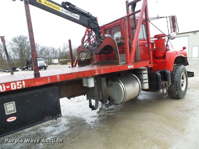 image for item DD1957 1989 Mack DM690S knuckle boom crane truck with grapple
