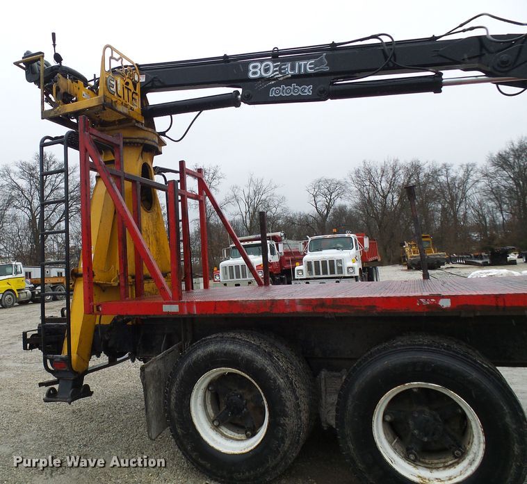 image for item DD1957 1989 Mack DM690S knuckle boom crane truck with grapple