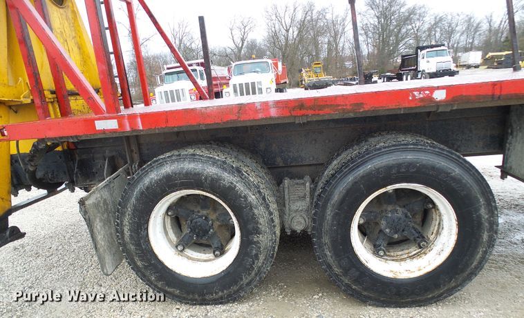 image for item DD1957 1989 Mack DM690S knuckle boom crane truck with grapple