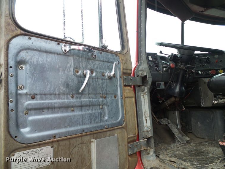 image for item DD1957 1989 Mack DM690S knuckle boom crane truck with grapple