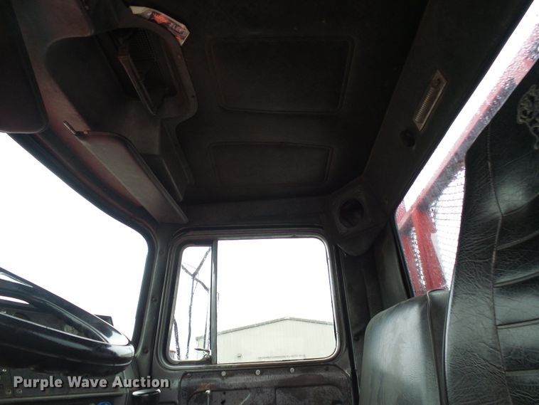 image for item DD1957 1989 Mack DM690S knuckle boom crane truck with grapple