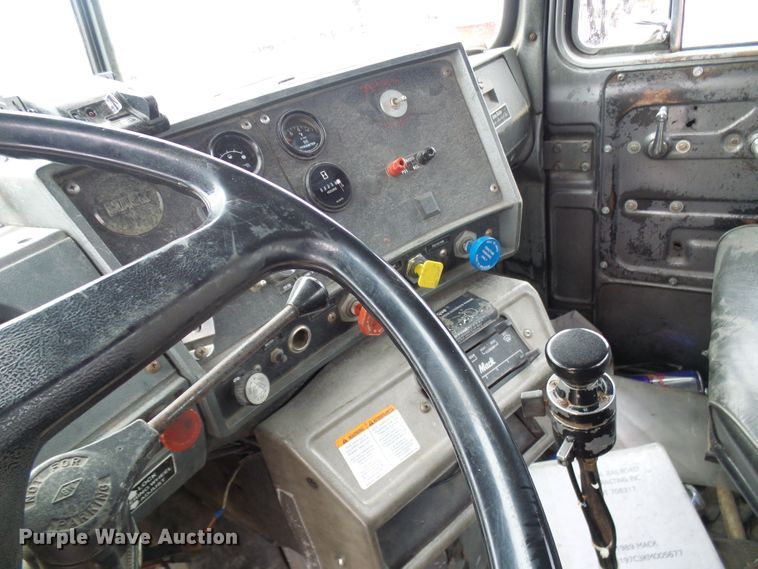 image for item DD1957 1989 Mack DM690S knuckle boom crane truck with grapple