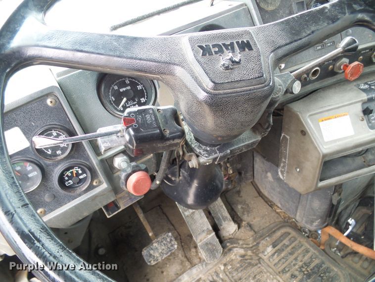 image for item DD1957 1989 Mack DM690S knuckle boom crane truck with grapple