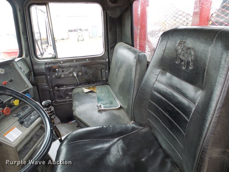 image for item DD1957 1989 Mack DM690S knuckle boom crane truck with grapple