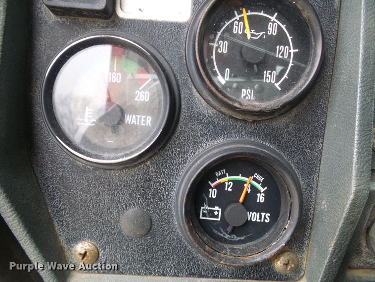 image for item DD1957 1989 Mack DM690S knuckle boom crane truck with grapple