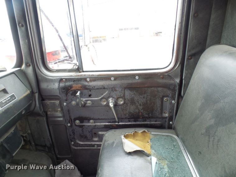 image for item DD1957 1989 Mack DM690S knuckle boom crane truck with grapple