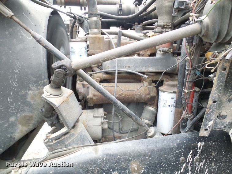 image for item DD1957 1989 Mack DM690S knuckle boom crane truck with grapple