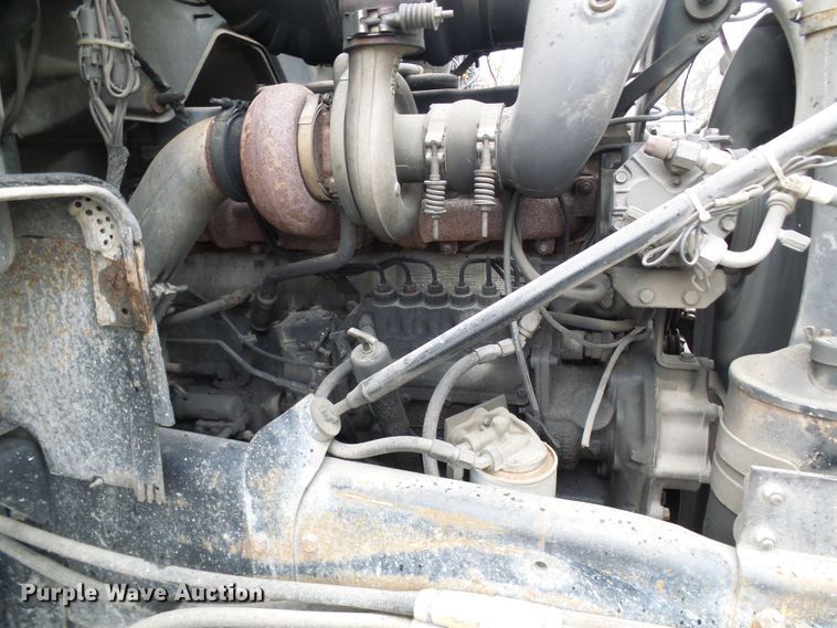 image for item DD1957 1989 Mack DM690S knuckle boom crane truck with grapple