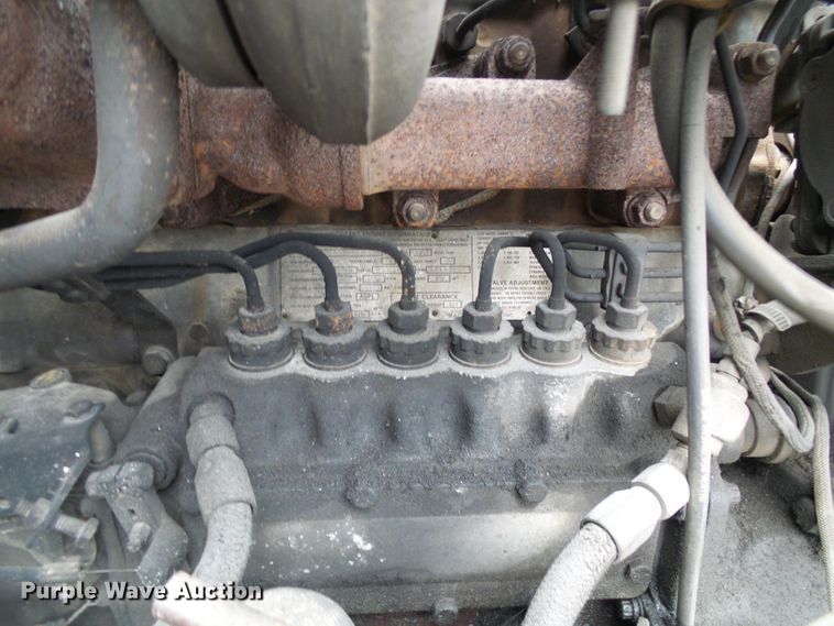 image for item DD1957 1989 Mack DM690S knuckle boom crane truck with grapple