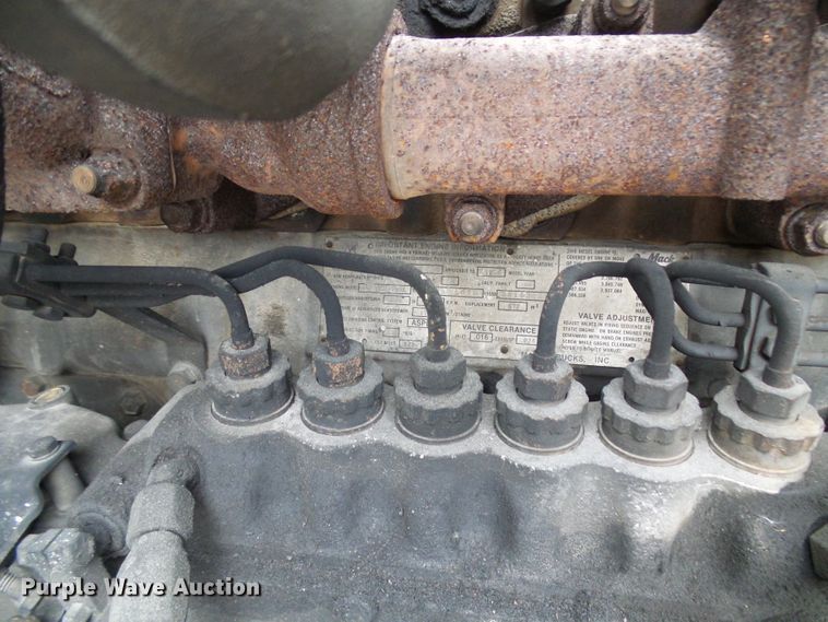 image for item DD1957 1989 Mack DM690S knuckle boom crane truck with grapple