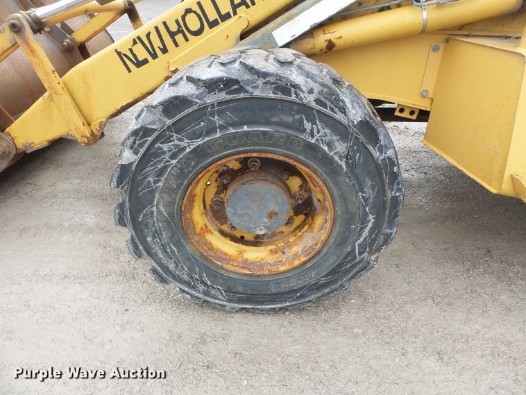 image for item DH7842 New Holland 555E backhoe