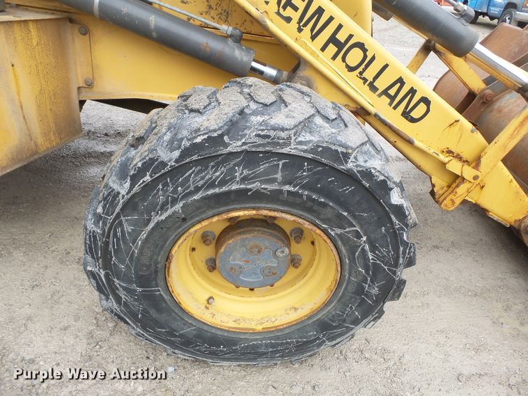 image for item DH7842 New Holland 555E backhoe