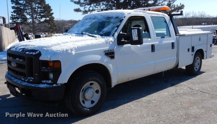 image for item DE4256 2009 Ford F250 Super Duty Crew Cab utility bed pickup truck