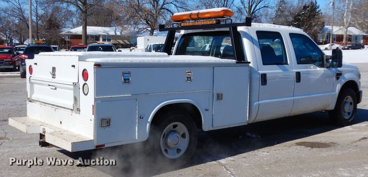 image for item DE4256 2009 Ford F250 Super Duty Crew Cab utility bed pickup truck