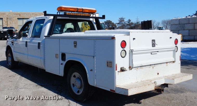 image for item DE4256 2009 Ford F250 Super Duty Crew Cab utility bed pickup truck