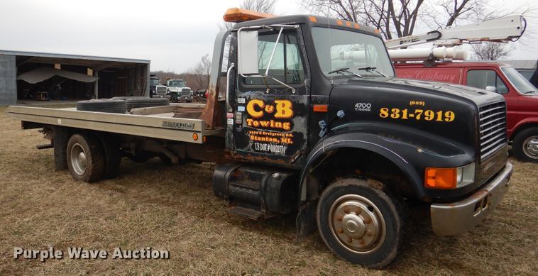 image for item EK9158 1999 International 4700 rollback tow truck