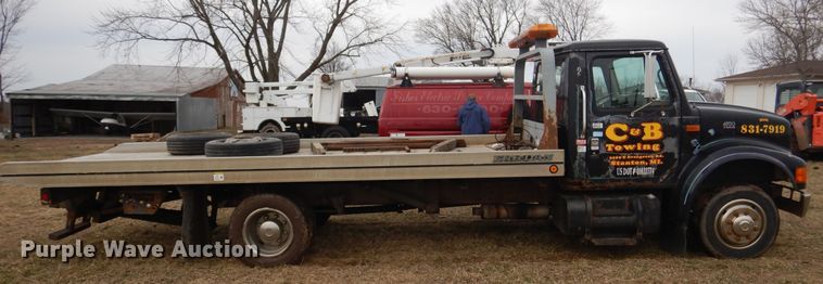 image for item EK9158 1999 International 4700 rollback tow truck