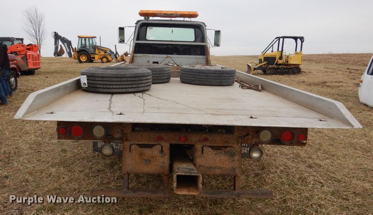 image for item EK9158 1999 International 4700 rollback tow truck