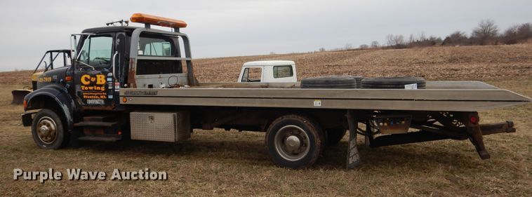 image for item EK9158 1999 International 4700 rollback tow truck