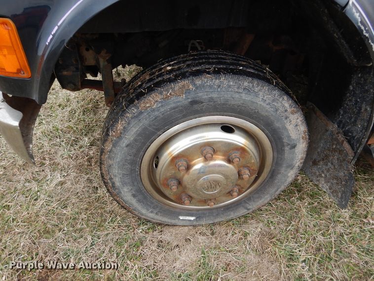 image for item EK9158 1999 International 4700 rollback tow truck