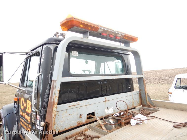 image for item EK9158 1999 International 4700 rollback tow truck